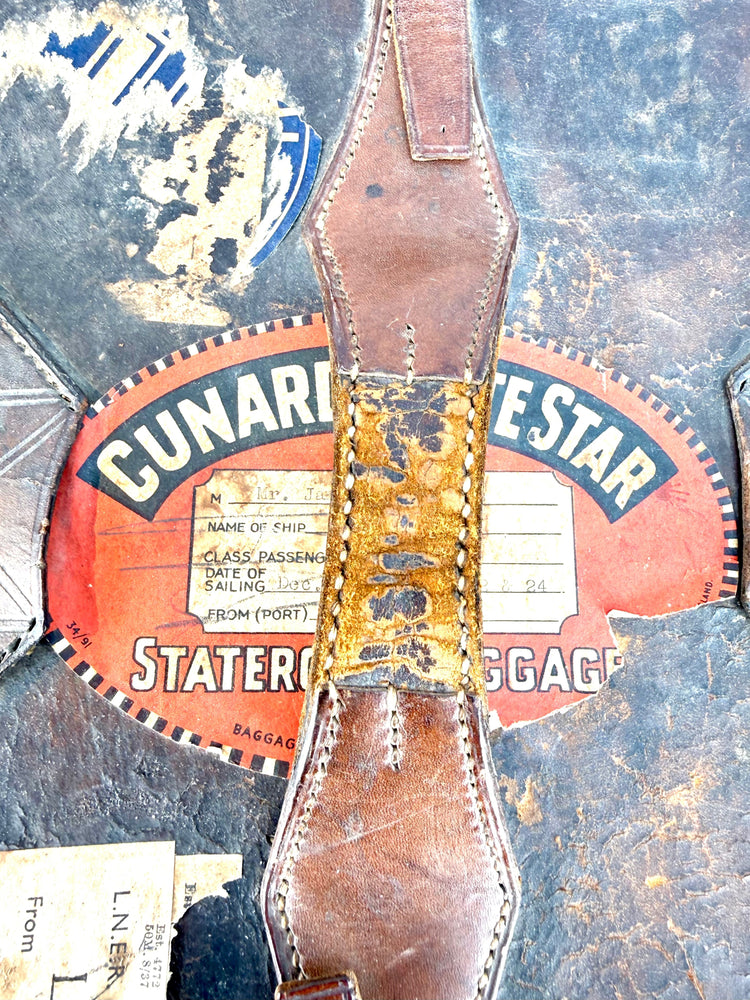 Antique British silk top hat with preserved interior textile lining and original manufacturer identification.