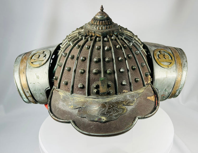 Japanese firefighting helmet with detailed metalwork and cultural significance