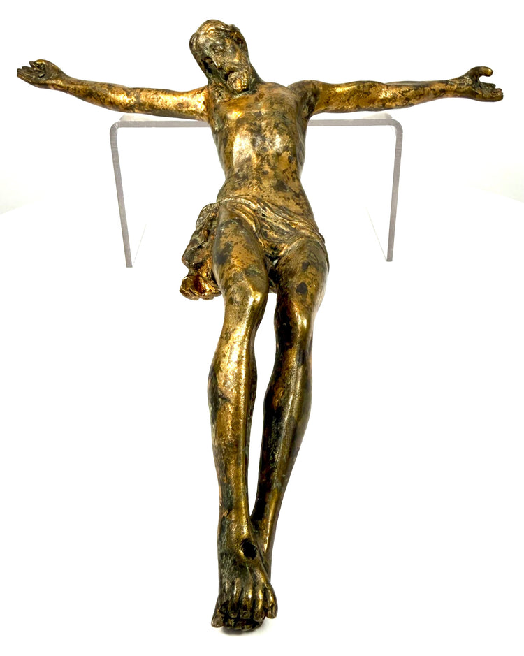 Antique gilt-bronze Corpus Christi showing the intricately modelled drapery gathered around Christ's right hip.