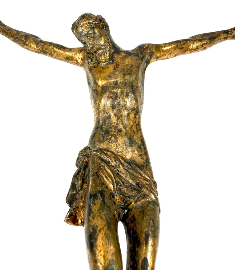 Renaissance to early Baroque bronze Christ figure with outstretched arms, bowed head, and surviving historic gilding.