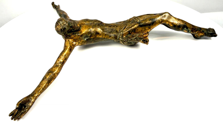 Historic gilt-bronze Corpus Christi displaying elongated anatomical proportions and carefully modelled musculature.
