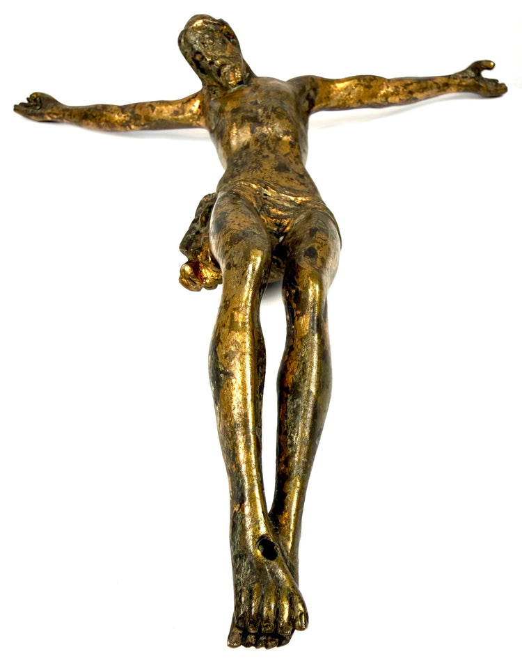 Historic cast bronze Corpus Christi with naturally developed oxidation, gilded highlights, and detailed anatomical modelling.