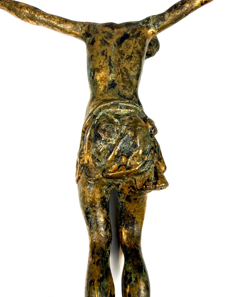 Sculpted perizonium loincloth on Renaissance bronze Christ figure, with deeply carved folds and knotted fabric.