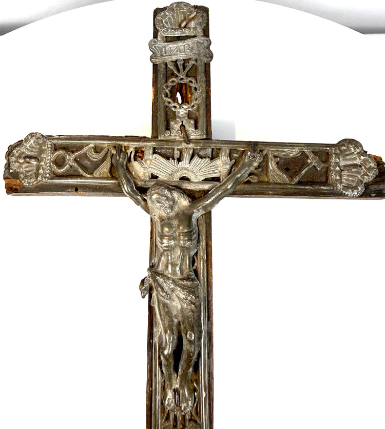 Traditional French devotional peddler’s cross displaying the crucified Jesus Christ surrounded by Instruments of the Passion.