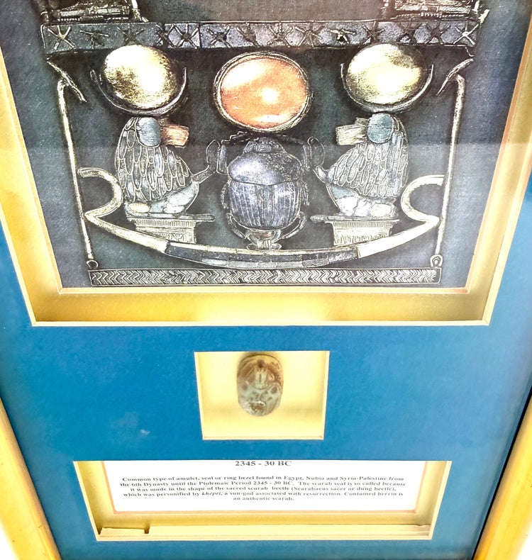 Ancient Egyptian glazed scarab displaying carved beetle features, linear patterns, and naturally aged surface details.