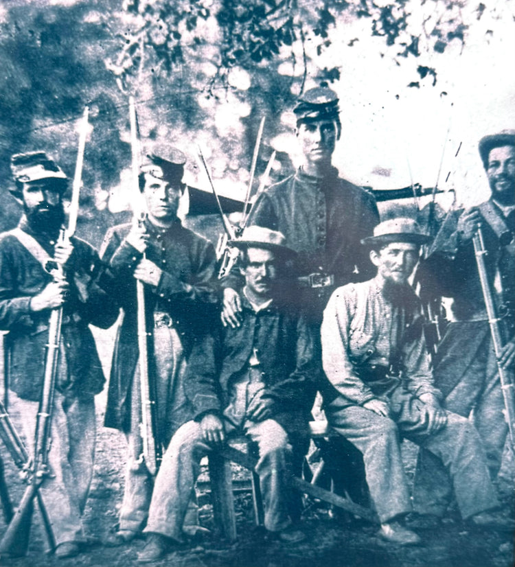 Reproduced American Civil War-era photograph depicting six armed men in period military clothing, accompanying a Confederate soldier's family relief voucher.