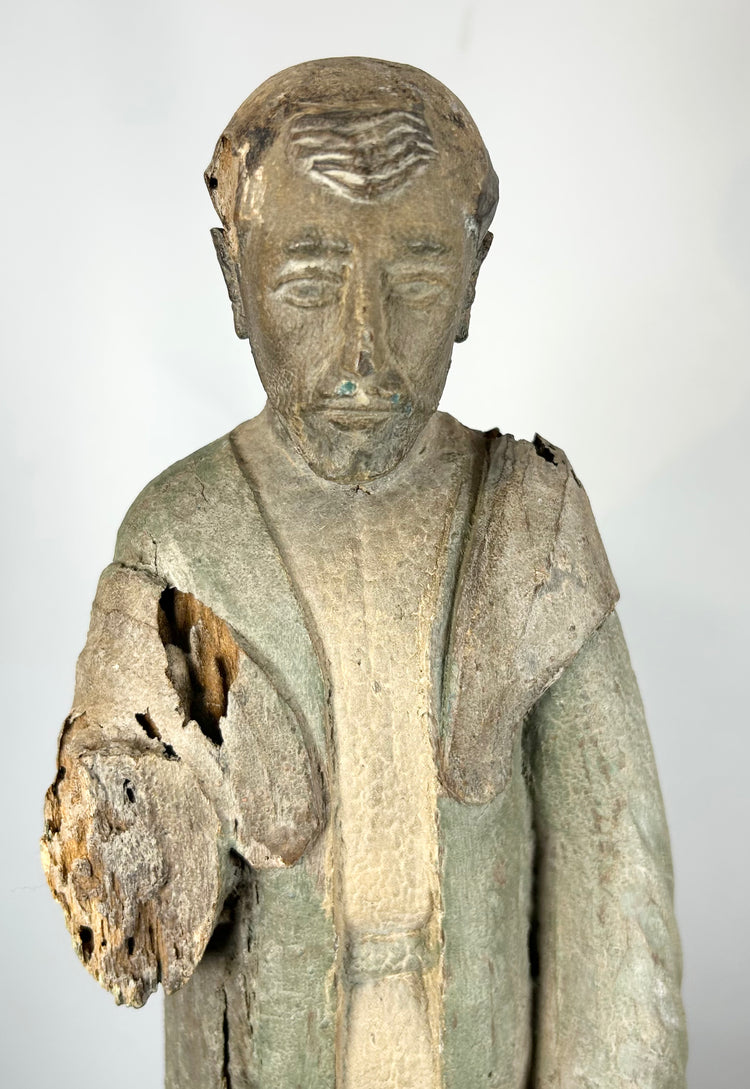 Colonial Latin American carved wood saint with expressive facial features