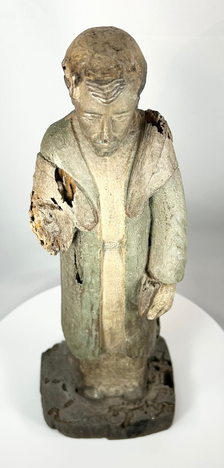 Spanish Colonial santo sculpture with integral base and weathered surface