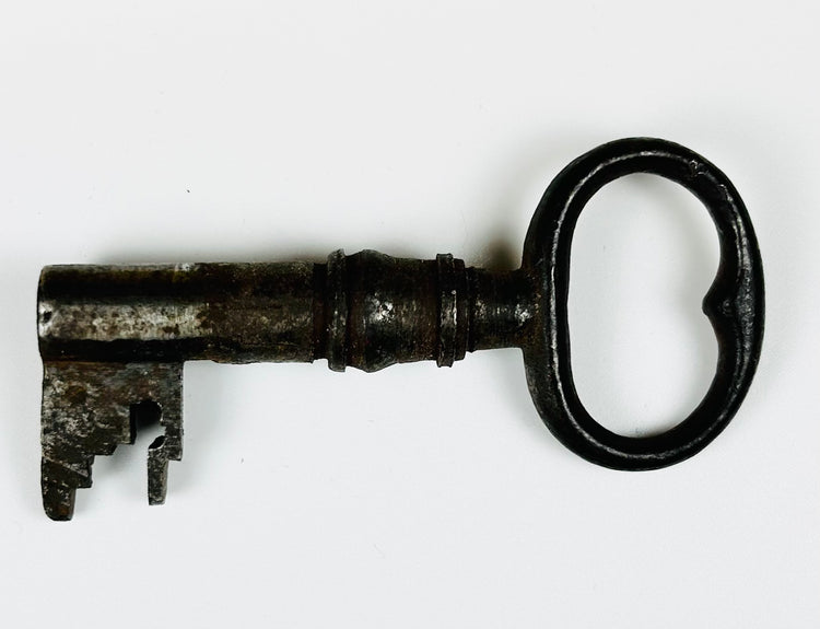 Historical iron door lock with original key and aged industrial character