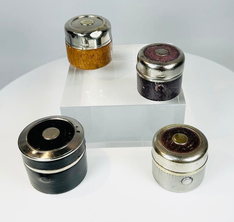 Antique desk accessories including travel inkwells with glass interiors