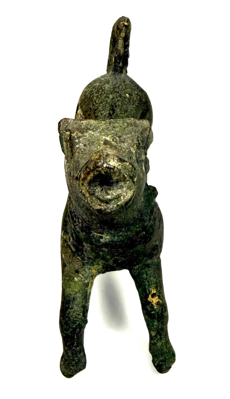 Roman bronze animal figurine with individually modelled legs, elevated hindquarters, and an animated barking posture.