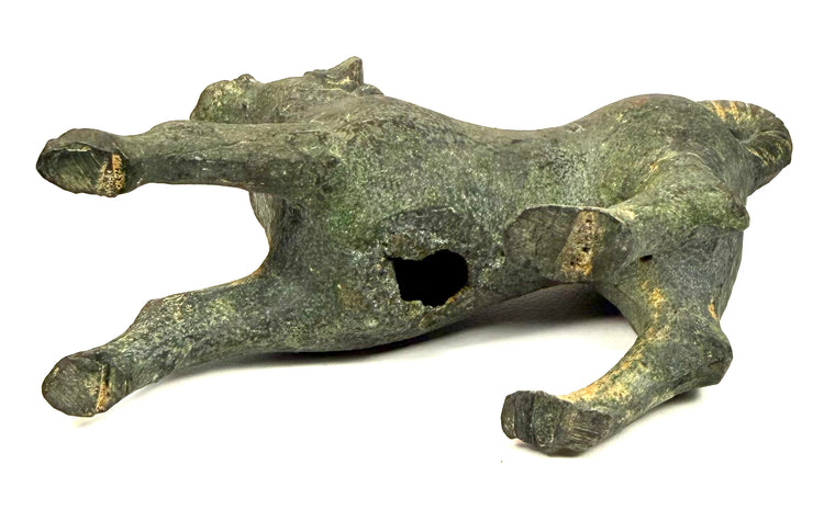 Ancient Roman bronze dog sculpture featuring a raised ornamental collar with rounded decorative elements around the neck.