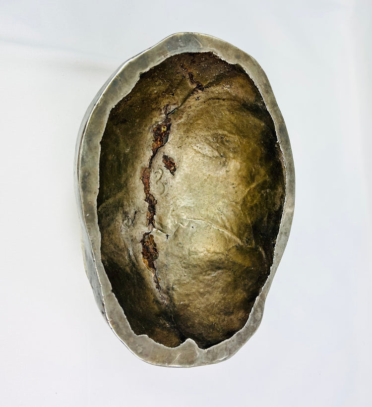 Interior view of 19th-century Tibetan Kapala ritual skull cup showing polished human bone and silver rim, used in Tantric Buddhist rituals.