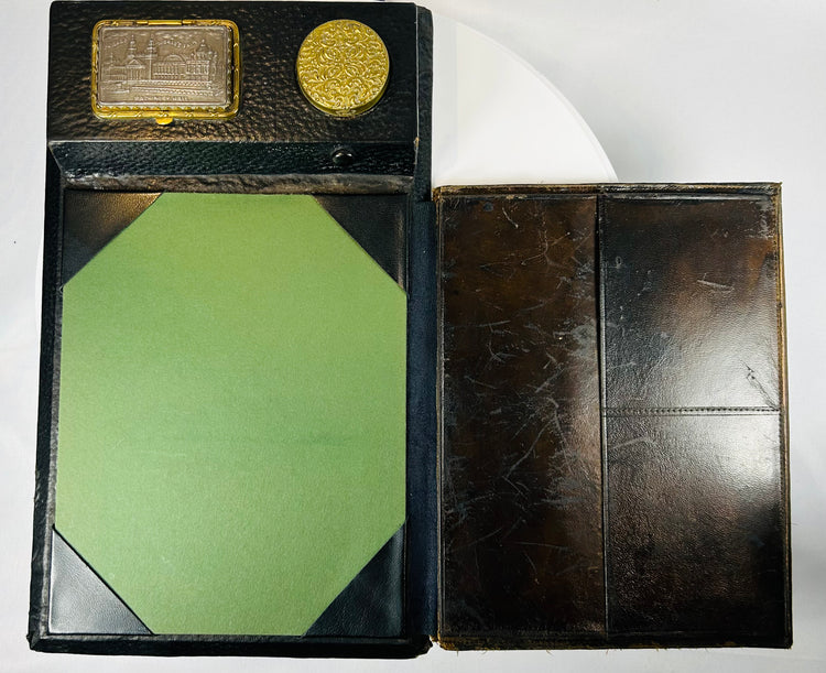 Leather-covered writing slope with brass fittings and inkwell section