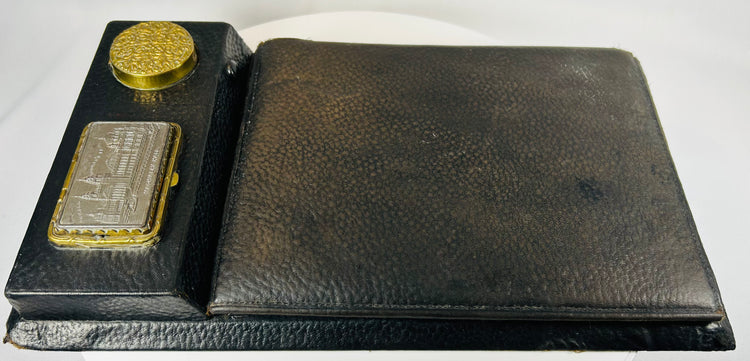 Antique writing slope interior showing slanted writing surface and storage