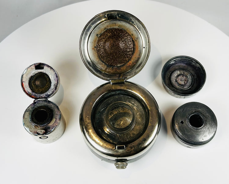Antique compact writing kit with ink pots showing patina and use wear