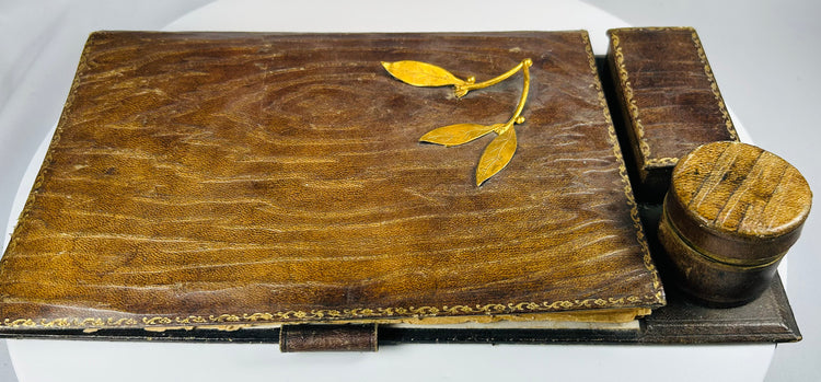 Antique writing box with fabric-lined compartments and ink storage