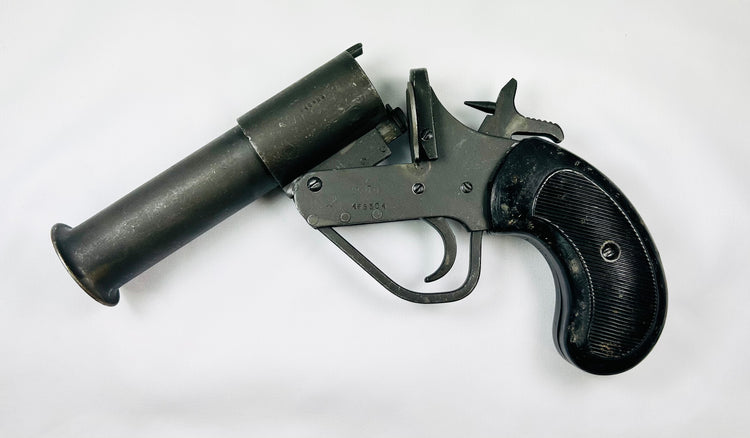 Original British WWII Webley MK. V flare gun, serial #148583, showing checkered black grips and lanyard ring