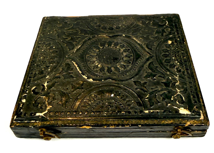 Original 19th-century hinged photographic case associated with Dr. Paul Sears, showing embossed ornamentation and age-related wear along the edges.