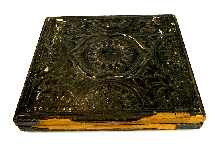 Exterior of a circa 1855–1865 American photographic keepsake case displaying decorative patterns, surface wear, and historic patina.