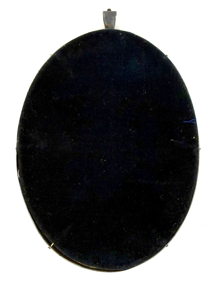 Reverse of the removable oval photographic portrait frame from a late Victorian folding presentation case, circa 1895–1915.