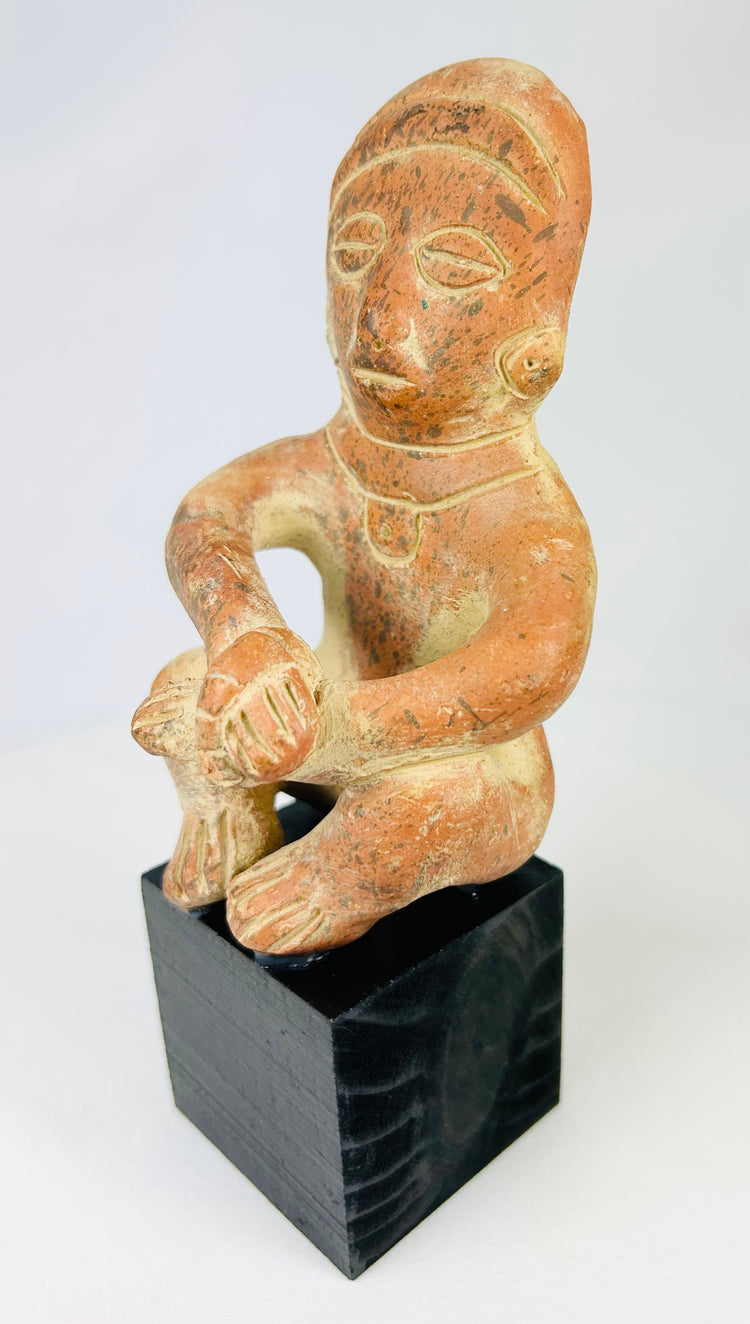 Nayarit/Jalisco Pre-Columbian terracotta funerary figure, circa 300 BCE–300 CE, seated pose, black display stand