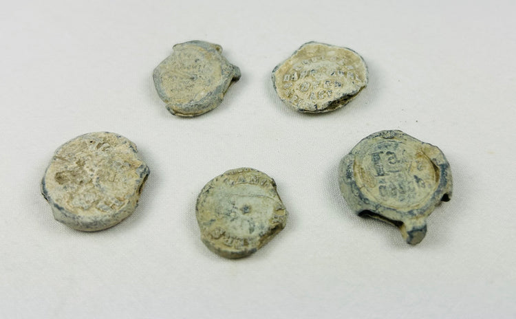 Set of five 18th–19th century English copper trade tokens, shipwreck-recovered, marine patina, historic maritime artifact