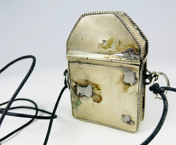 Tibetan devotional travel shrine with detailed silver repoussé work