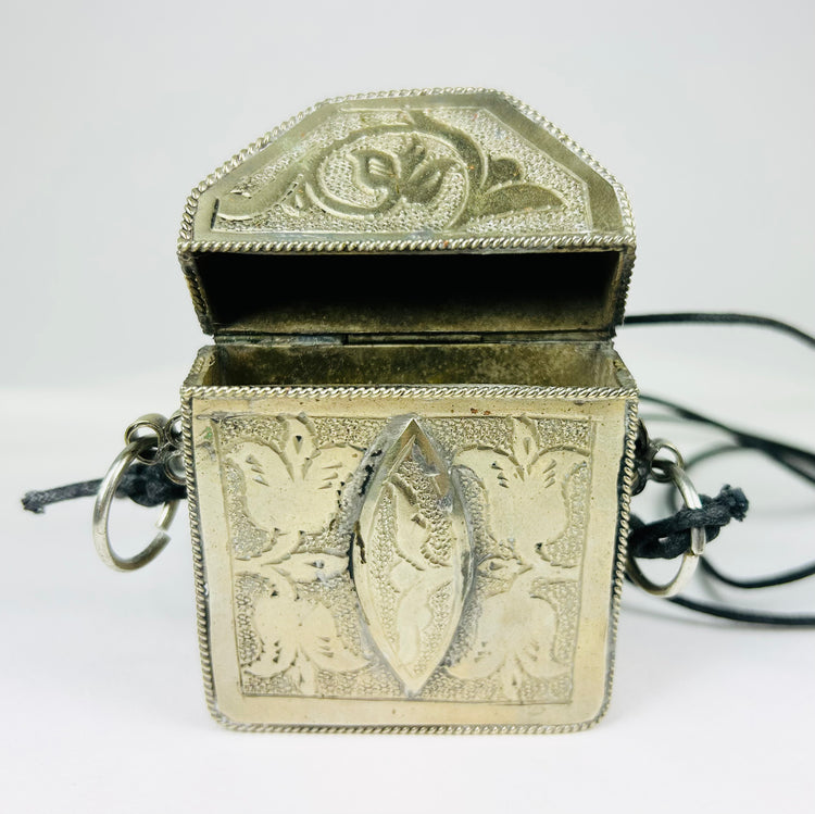 Antique Tibetan wearable altar with floral and symbolic patterns