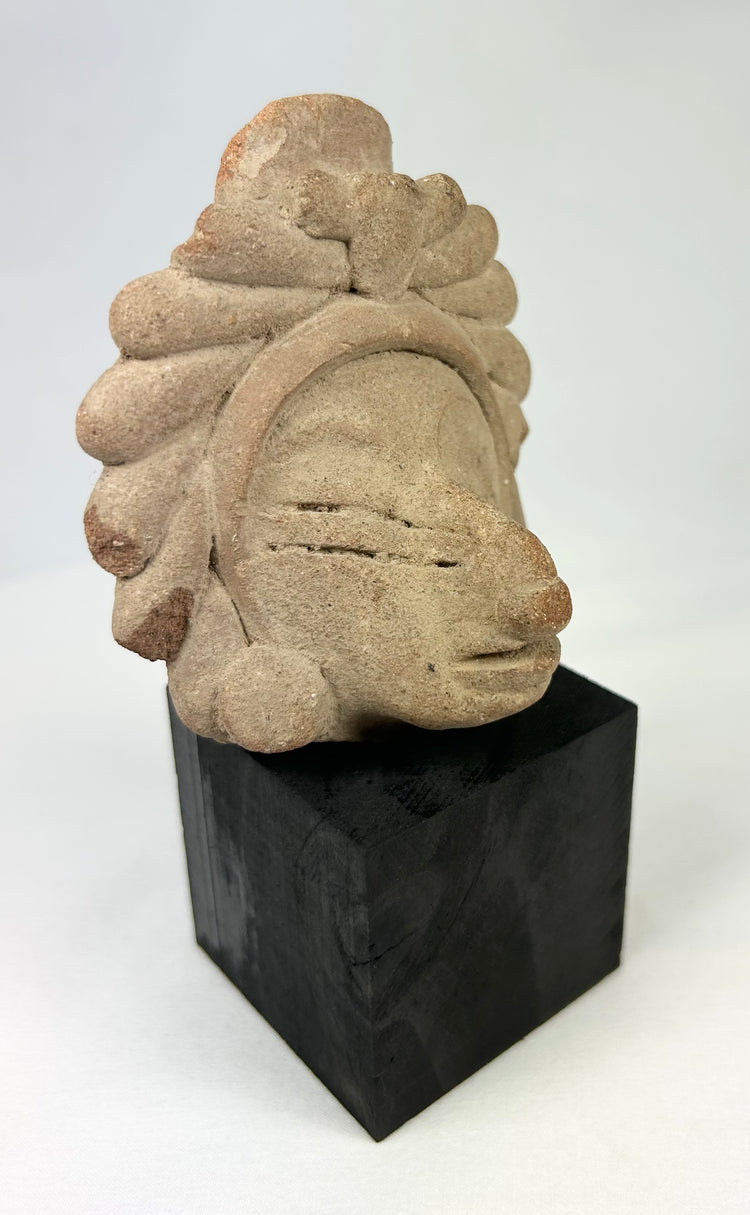 Javanese Majapahit temple fragment, Kala Simha guardian head carving with stylized radiating mane