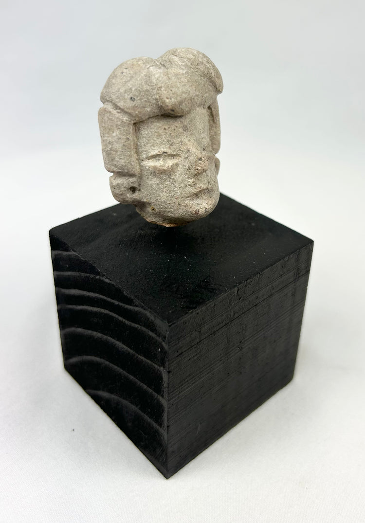 Ancient Pre-Columbian terracotta fragment with stylized coiffure and straight nose