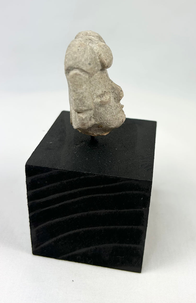 West Mexican terracotta head fragment mounted on black display base