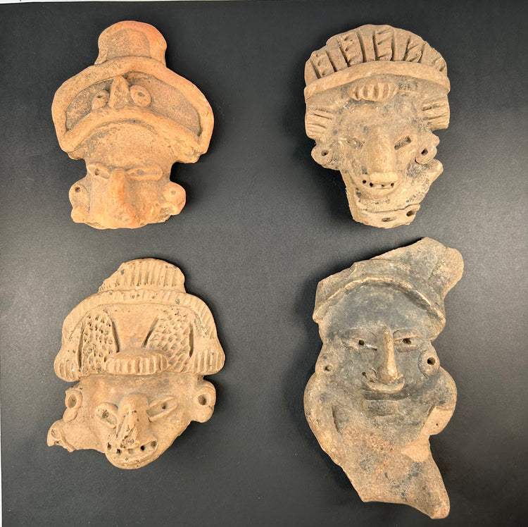 Pre-Columbian terracotta face fragments with varied expressions and headdresses