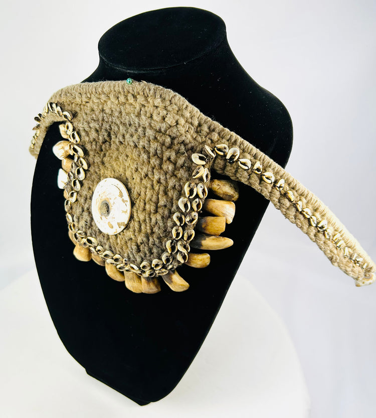 Papua New Guinea 19th–20th century ceremonial ornament, woven fibers, cowrie and teeth accents