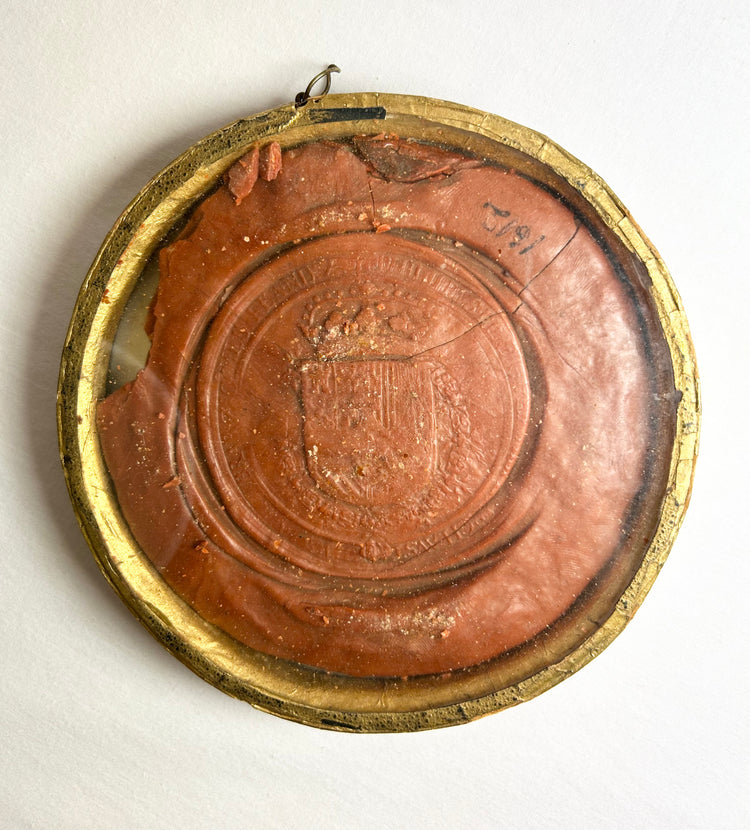 Historic red wax seal of Philip IV featuring throne scene and inscription