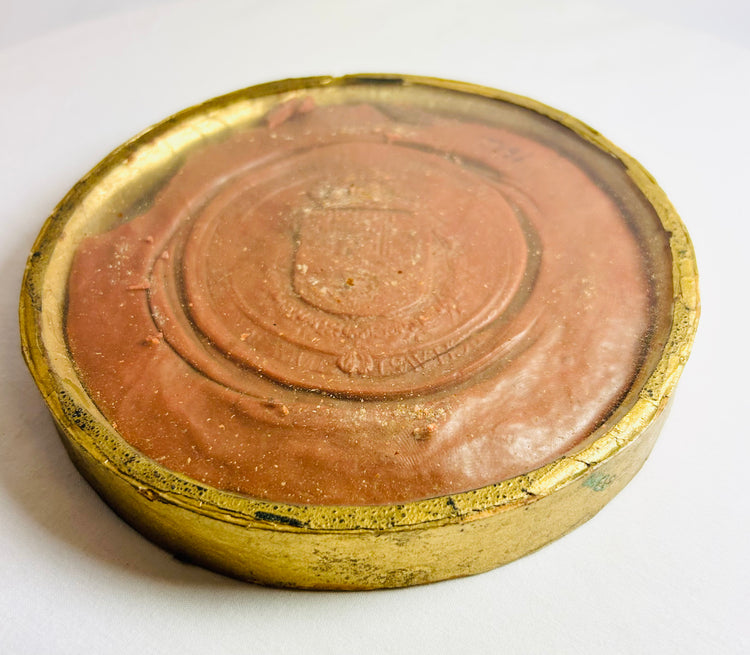 Red circular seal of King Philip IV with intricate monarch motif and Latin legend