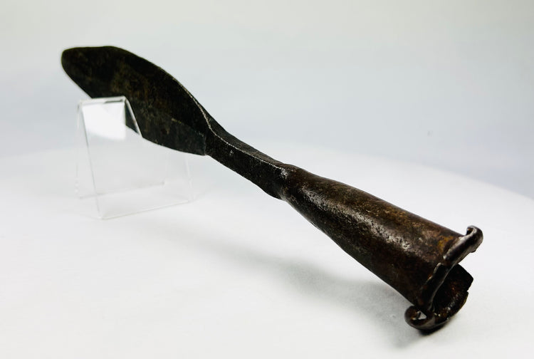 Antique iron spearhead showing natural patina and historic wear