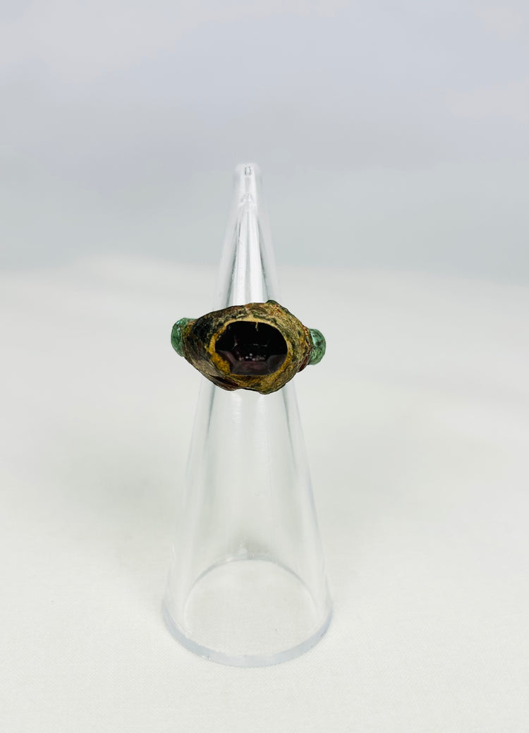 Ancient Assyrian bronze ring with garnet intaglio from 9th–7th century BCE