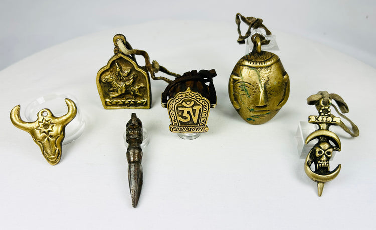Bronze Tibetan amulets with bull head, phurba dagger, and skull KILL design