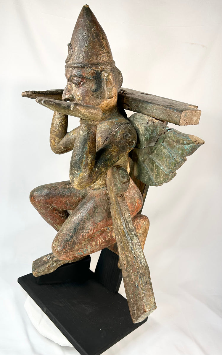 Bronze Garuda sculpture — left-side profile highlighting detailed carving