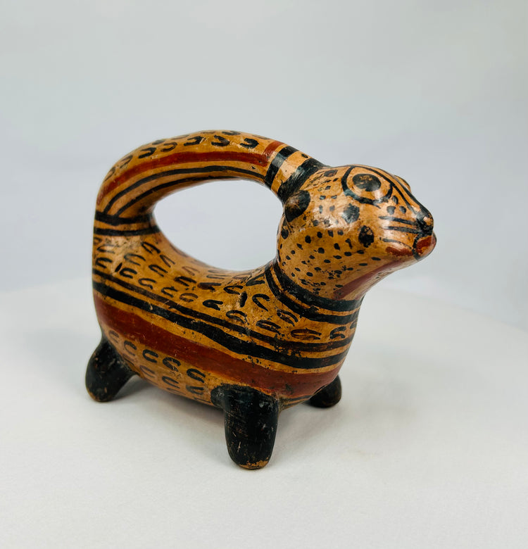 Ancient Costa Rican ceramic jaguar effigy vessel with spotted slip pattern and rounded spout handle