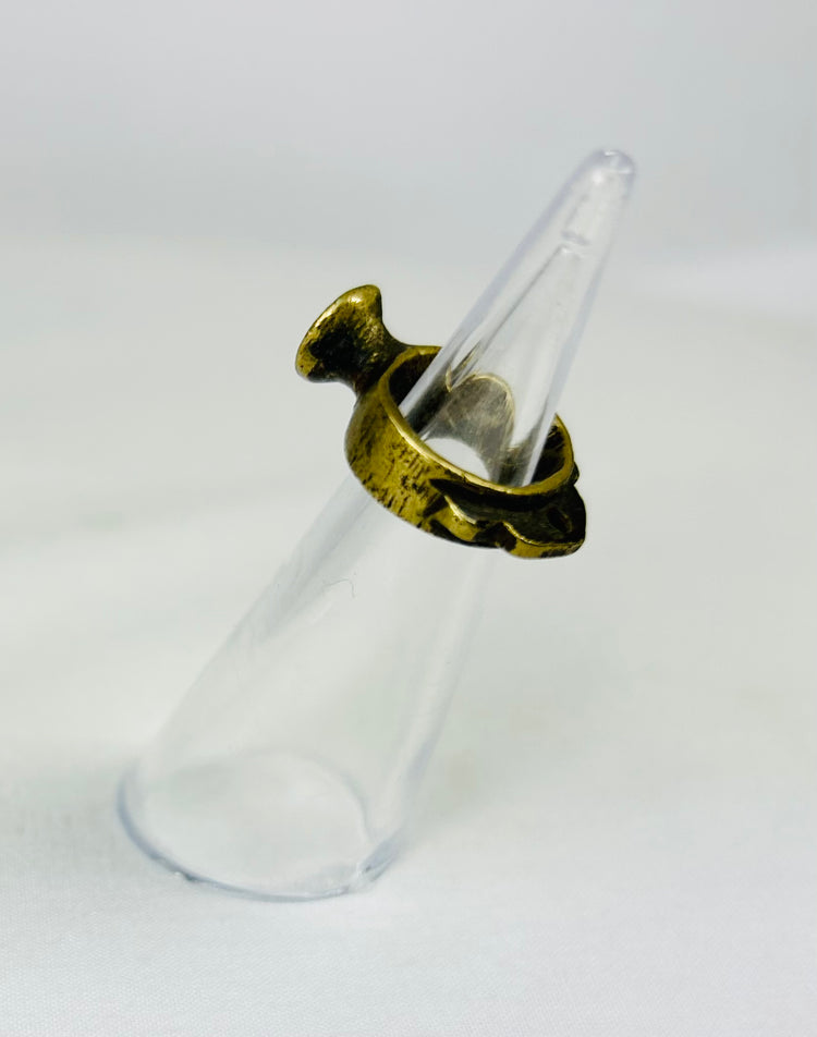 Side angle of Roman bronze ring highlighting the thick, rounded band and aged surface texture.