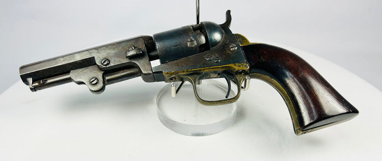 Antique Colt 1849 Pocket Revolver with stagecoach robbery engraving, 4-inch octagonal barrel, original walnut grip