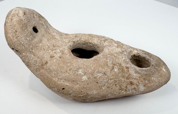 Archaeological terracotta oil lamp with pierced rear suspension lug