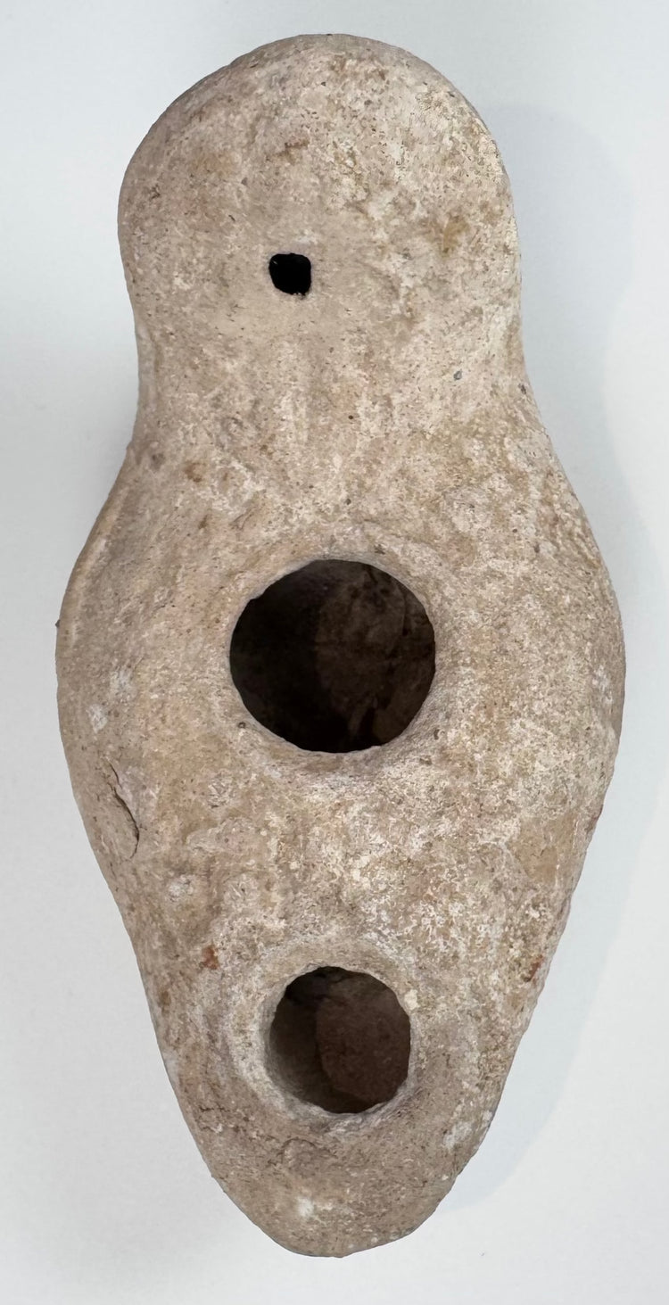 Near Eastern terracotta oil lamp with rounded enclosed reservoir