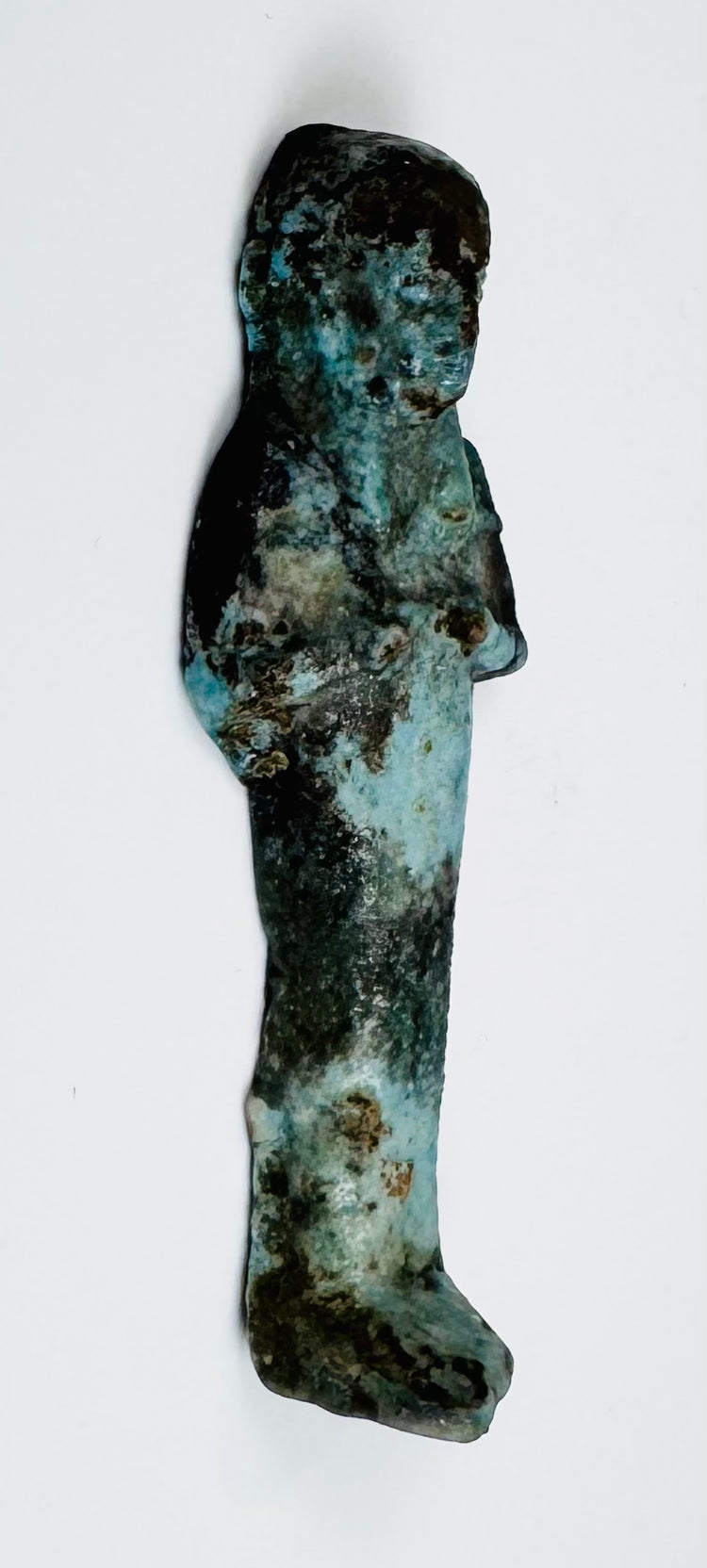 Egyptian faience funerary servant with mineral encrustation and glaze loss