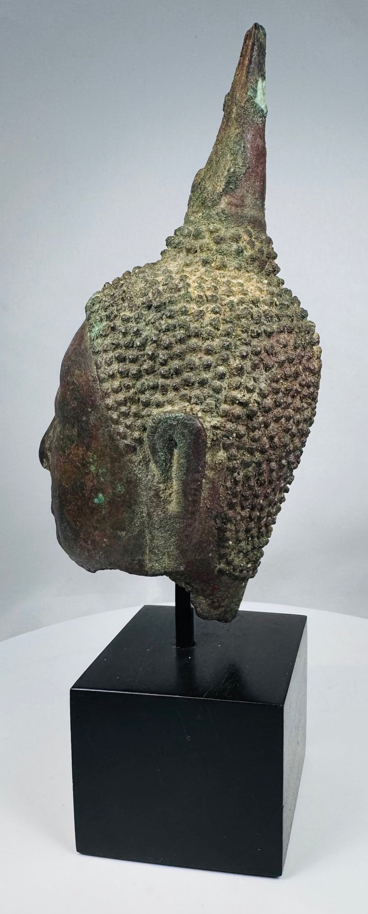 Fragmentary Sukhothai bronze Buddha head with extensive verdigris patina