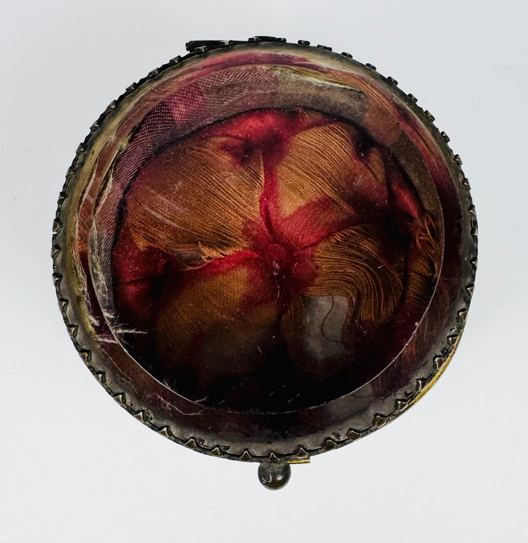 Original red and golden-orange textile interior of antique jewelry casket