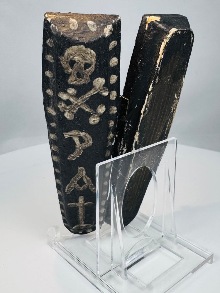 Textile-wrapped skeletal figure with carved skull and incised teeth