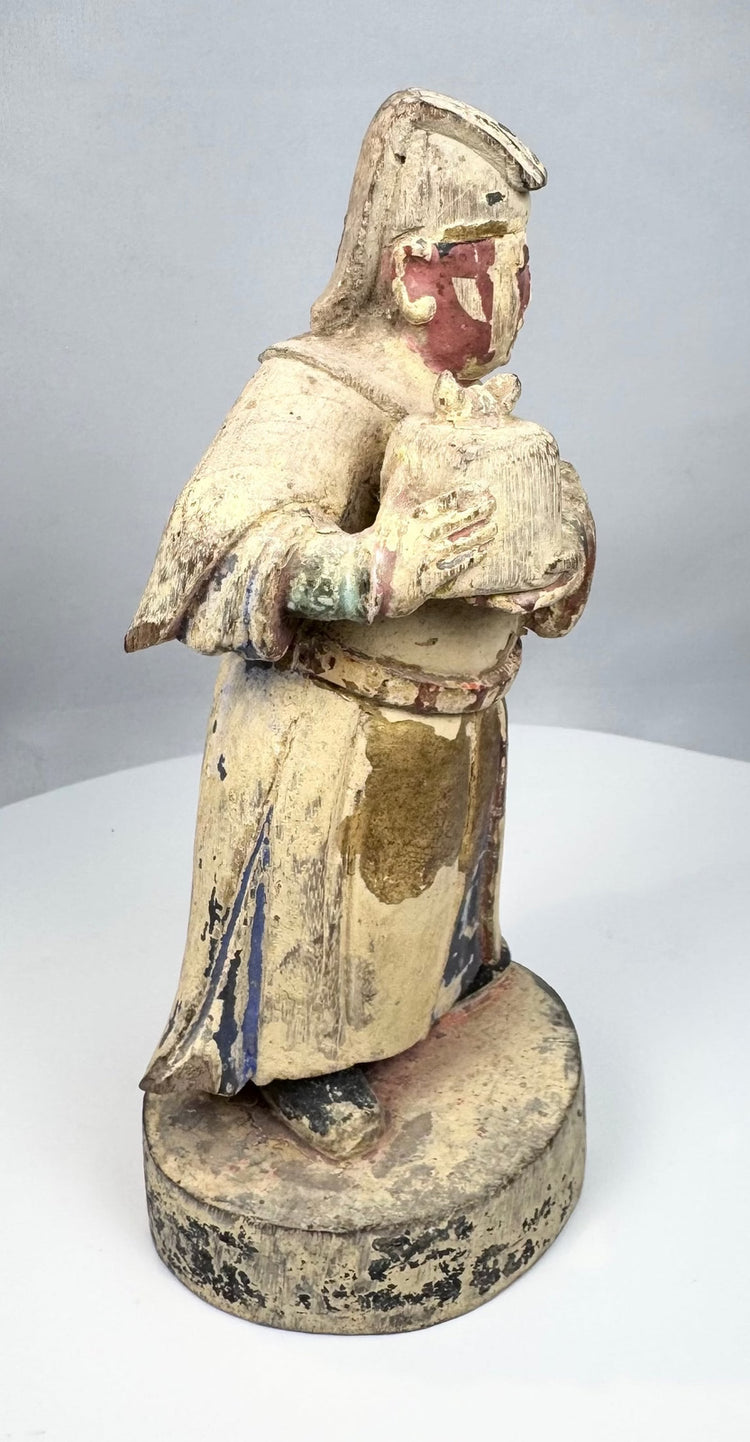 Chinese carved wood official wearing a broad-sleeved ceremonial robe
